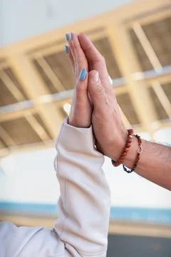 Close-up of two hands coming together, symbolizing trusting each other Stock Photos