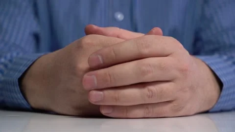 Close-up of two hands folded with fingers Stock Footage 167212466