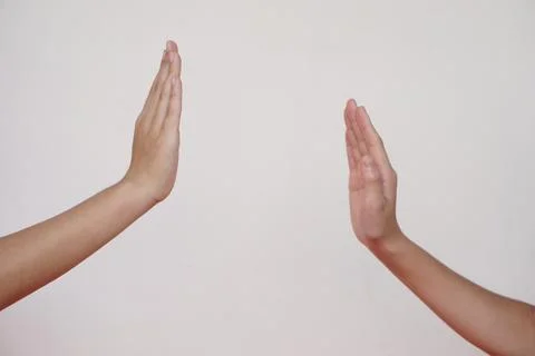 Close up two hands giving high five or touching hands for greeting. Concept, Bod Stock Photos