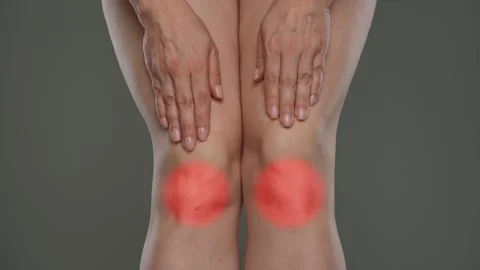 Close Up of Two Hands Resting on Bare Knees Stock Footage 312250986