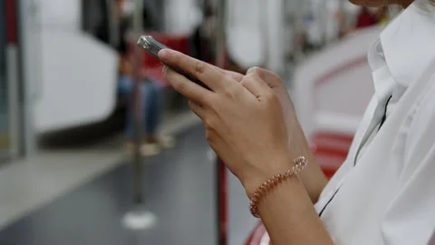 Close-up two hands sitting holding phone sitting typing mobile phone fast, .. Stock Footage 245100440