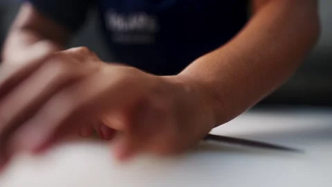 Close up of two hands smashing and crushing a garlic clove Stock Footage 305159456