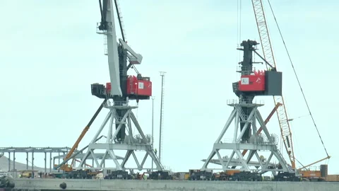 Close-up of two heavy lifting cranes in a seaport Stock Footage 232213635
