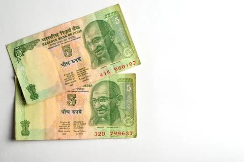 Close-Up of Two Indian Five Rupee Notes on a Light Background Stock Photos