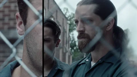 Close-up of two inmates standing next to each other, 2000s, USA - Reenactment Stock Footage 243734792