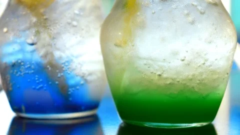 Close-up, two jugs with cold colored lemonade Stock Footage 103622418