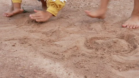 Close up of two little sisters playing with sand in park on a sunny summer day. Stock Footage 160714305