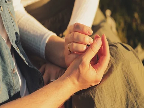 Close up of Two Lovers Holding Hands. SLOW MOTION 4K. Video stock 77817238