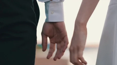 Close up of two Lovers Joining Hands Stock Footage