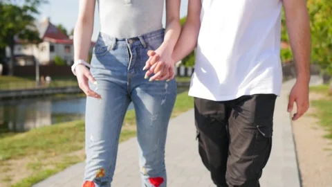 Close up of two lovers joining hands. Detail silhouette of man and woman holding Stock Footage 116665583