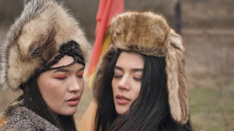 Close-up of two loving asian young women with closed eyes in ethnic clothes Stock Footage 151934508