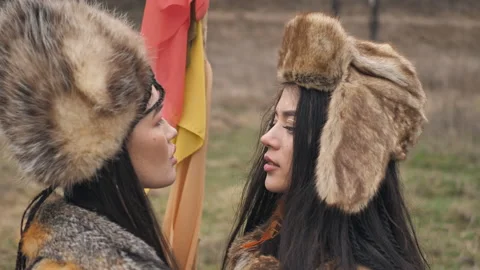 Close-up of two loving asian young women in ethnic clothes looking at each other Stock Footage 152265076