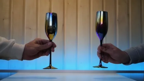 Close up of two male hands clinking fancy glasses and toasting 스톡 동영상 197078858