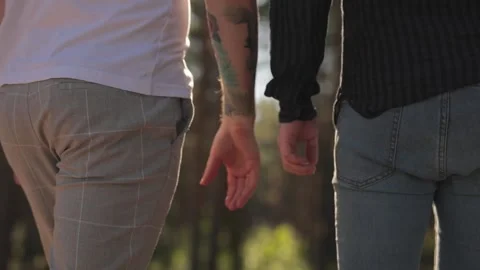 Close Up of Two Male Hands Gently Touching and Holding Each Other. Cute Queer Stock Footage 133676567
