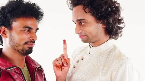 Close up two man smiling talking looking each other on white background Stock Footage 262935013