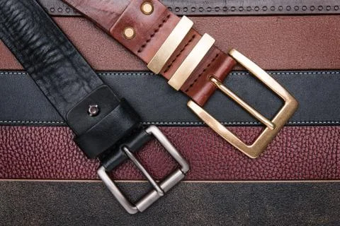 Close-up of two men belts Stock Photos