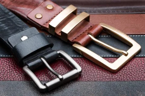 Close-up of two men belts Stock Photos