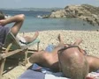 Close up of two men lying on beach SD Footage