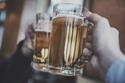 Close-up of two men toasting with beer Stock Photos