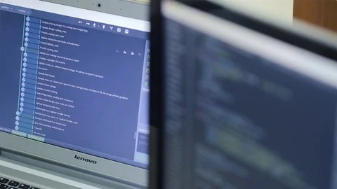 Close-up of two monitors programmer code Stock Footage 75312508