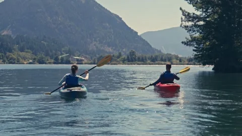 Close Up Two People on Kayaks on River in Oregon Washington Columbia Gorge Stock Footage 280702227