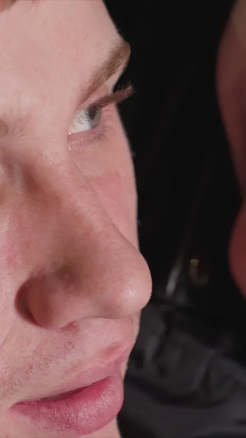 Close up of two people lying close together with focus on facial features and Stock Footage 346237843