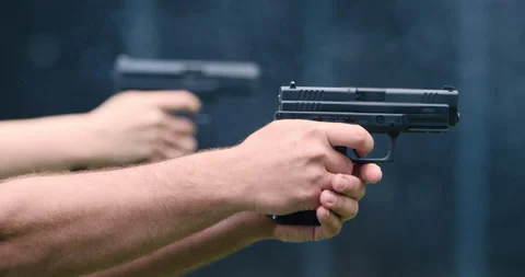 Close Up Of Two People Shooting Their Guns Stock Footage 145480490