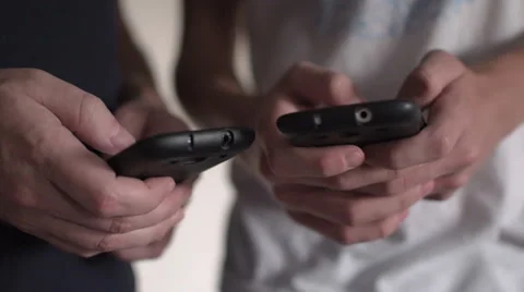 Close-up of two people using smart phone 스톡 동영상 54992975