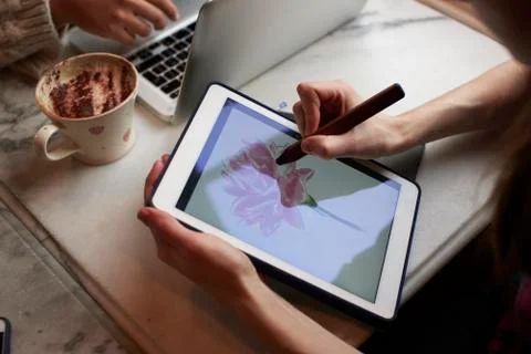 Close Up Of Two People Working Remotely In Cafe Stock Photos