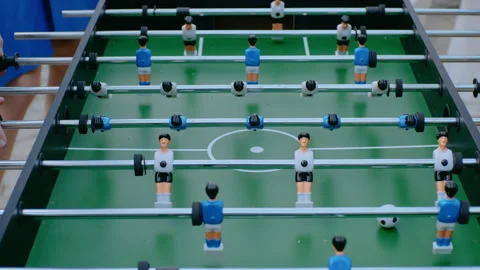 Close-up of two person playing table soccer. Video stock 165807377