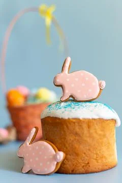 Close up of two pink gingerbread in the form of a rabbit on Easter cake Stock Photos