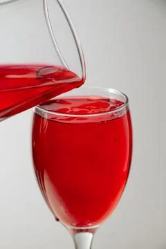 Close-up of two red liquid glasses filled with red liquid Stock Photos