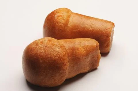 Close up on two rum baba on white. Stock Photos