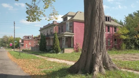 CLOSE UP: Two semi-detached abandoned decaying houses in Detroit Stock Footage 76717864