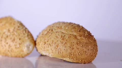 Close up of two sesame buns on rotating table 動画素材 106621160
