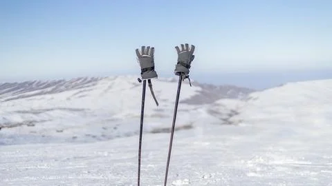 Close up of two ski poles on winter mountains background. Ski equipment Stock Photos