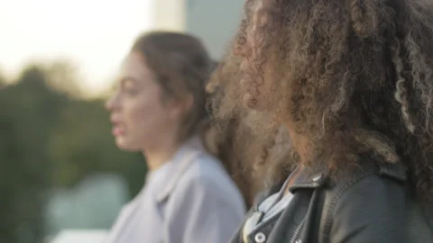 Close-up of two smiling colleagues having conversation in the terrace Stock Footage 133156195