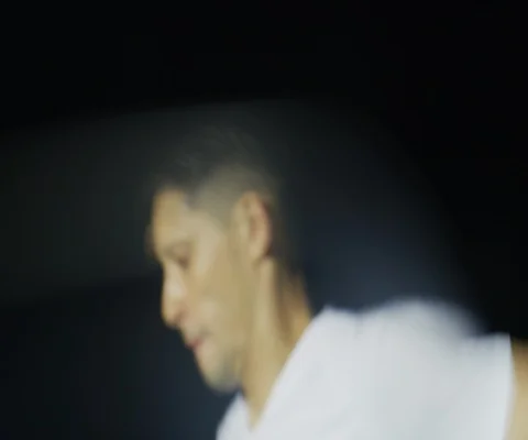 Close up of two soccer players practising on indoor football stadium at night Stock Footage 147061031