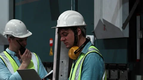 Close up two specialists inspect commercial, Wear safety uniform  Video stock 173354885