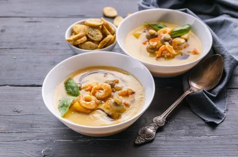 Close-up two spoon vegetable soup with prawns and mushrooms. Healthy and Low- Stock Photos