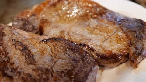 Close-up of two steaks on a plate Stock Footage 171360531