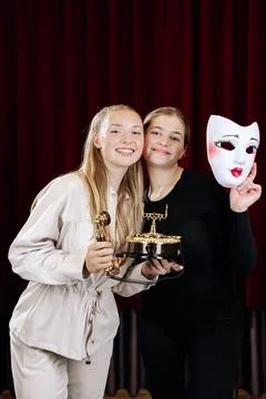 Close-up of two theatre actresses displaying strong emotions in their roles. Stock Photos