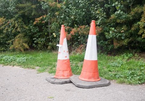 Close up of two traffic cones on pavement Stock Photos