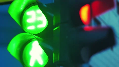 Close-up. Two traffic lights turn red and turn green. Countdown seconds. City Stock Footage 142649404