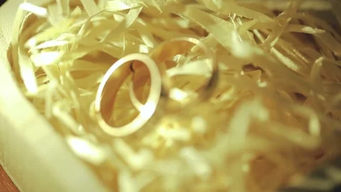 Close up two wedding gold rings at the table Stock Footage 310802998