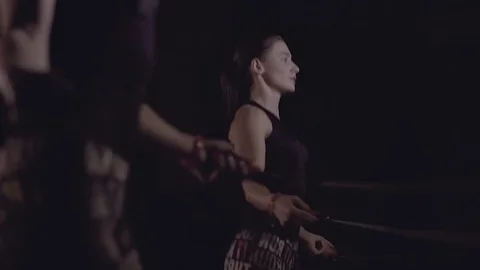 Close-up of two women jumping over ropes synchronously. 库存影片 76909503