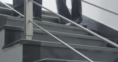 Close-up of two women's footsteps,walk down the stairs. Stock Footage 172096306