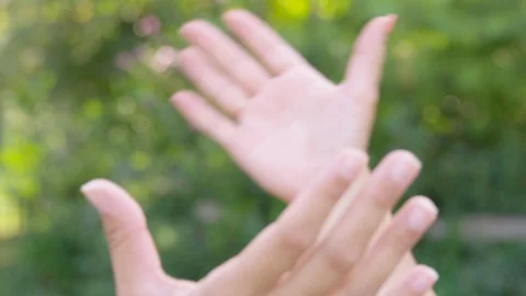 Close Up - Two women's hands grip together in solidarity - shot on RED Stock Footage 124918611
