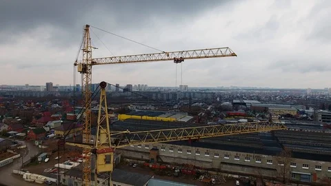 Close-up of two yellow construction cranes on the background of the city. Stock Footage 104646428
