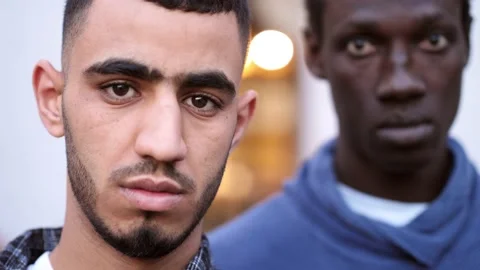 Close up of two young african man in the city serious angry face portrait Stock Footage 218592577